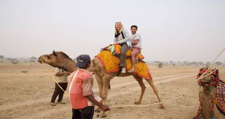 Couple enjoying Camel Safari in Jodhpur Image